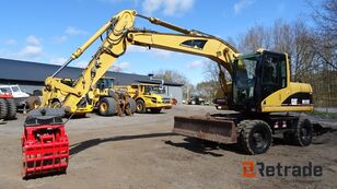 Caterpillar M 313C wheel excavator