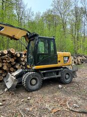 Caterpillar M313D / nowe opony / rotolit / szybkozłącze / 2011 r.   wheel excavator